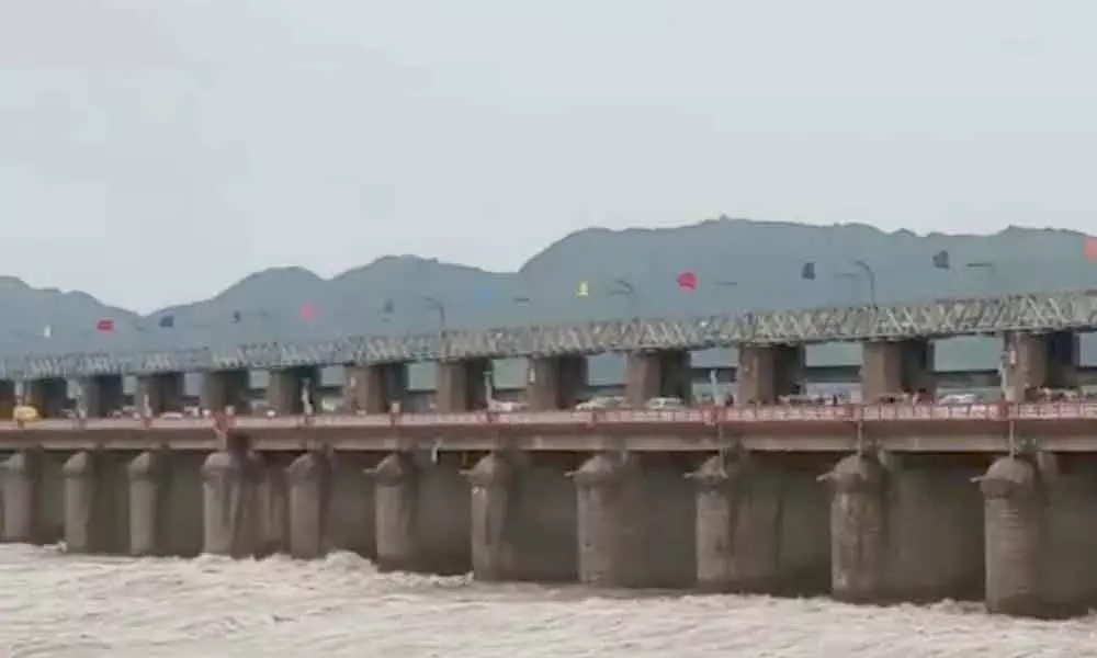 Krishna River flood water inflow increases, 35 gates lifted in Prakasam barrage