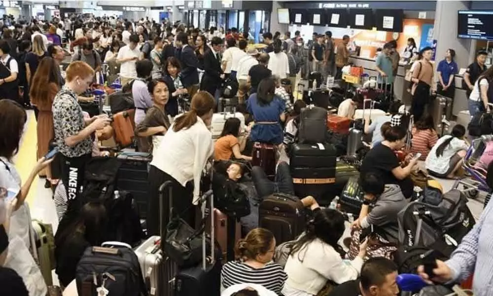 Typhoon troubles: 17,000 people stranded at Tokyo airport