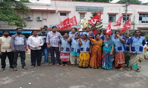 Sanitation workers stage dharna in Kakinada