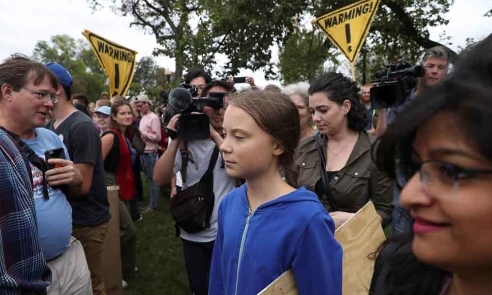 Teenage activist takes climate protest to Trump