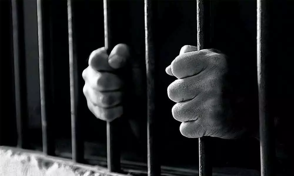 Man held for blackmailing woman