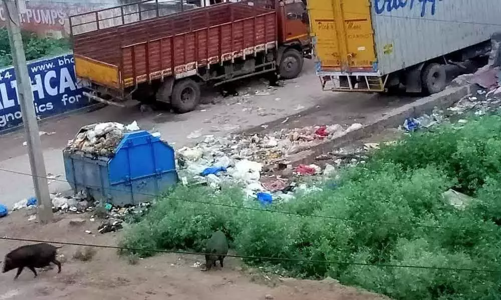 Garbage right on road, commuters rankled