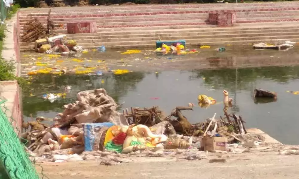 People join hands to clean up pond