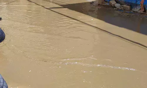 Drainage water overflows on road