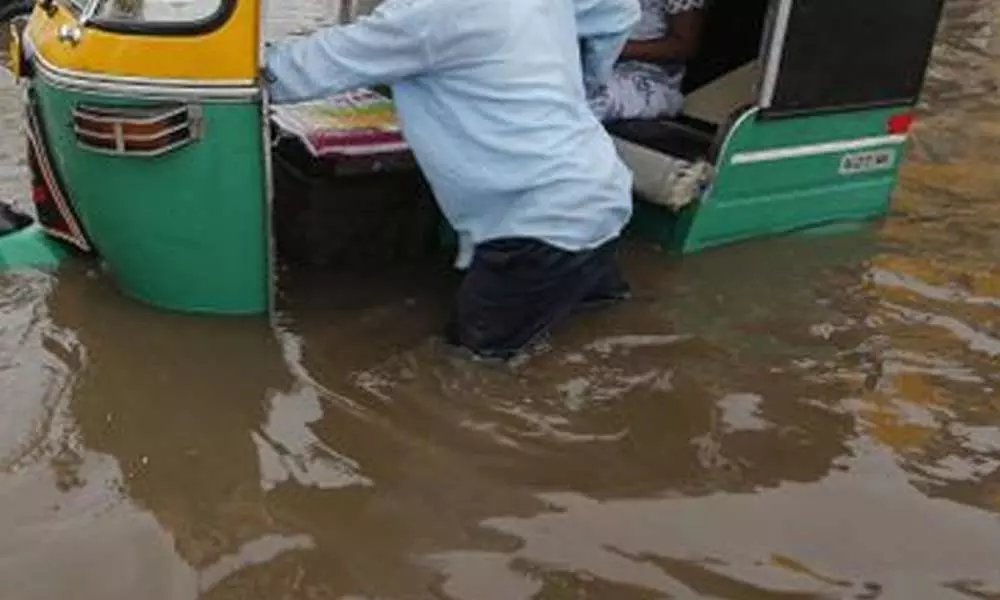 Heavy Floods In Kadapa: An Auto Rickshaw Drowns