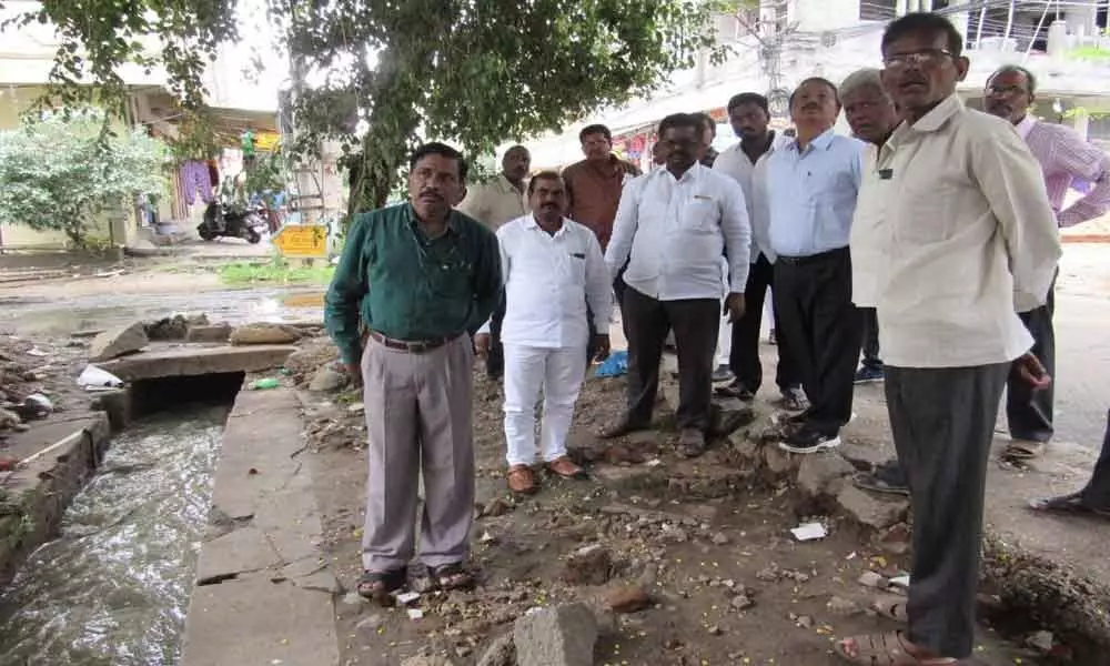 Corporator Pannala Devender Reddy inspects nala condition in Bhavani Nagar