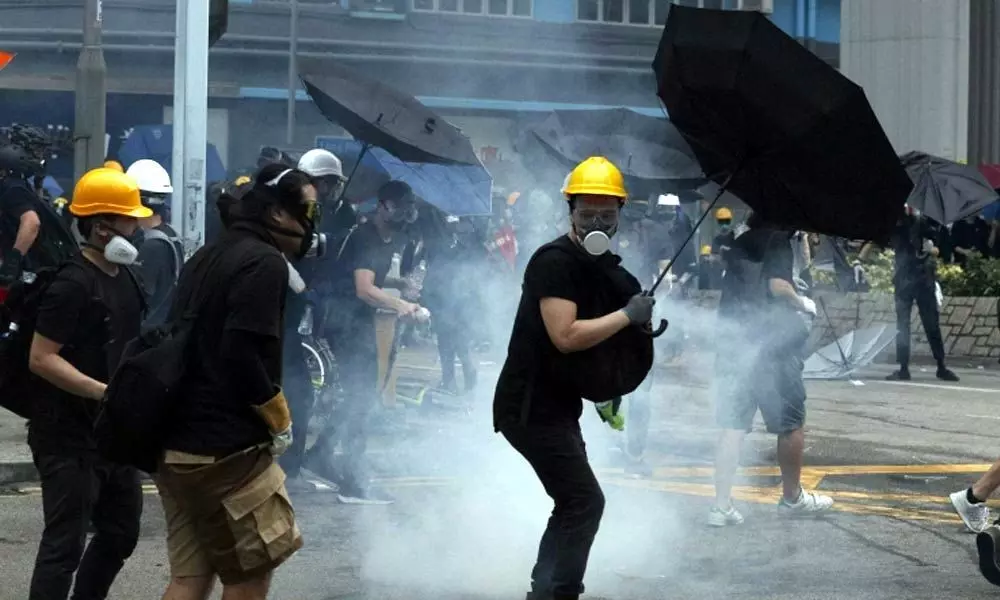 Hong Kong police, protesters clash in 16th weekend of rallies