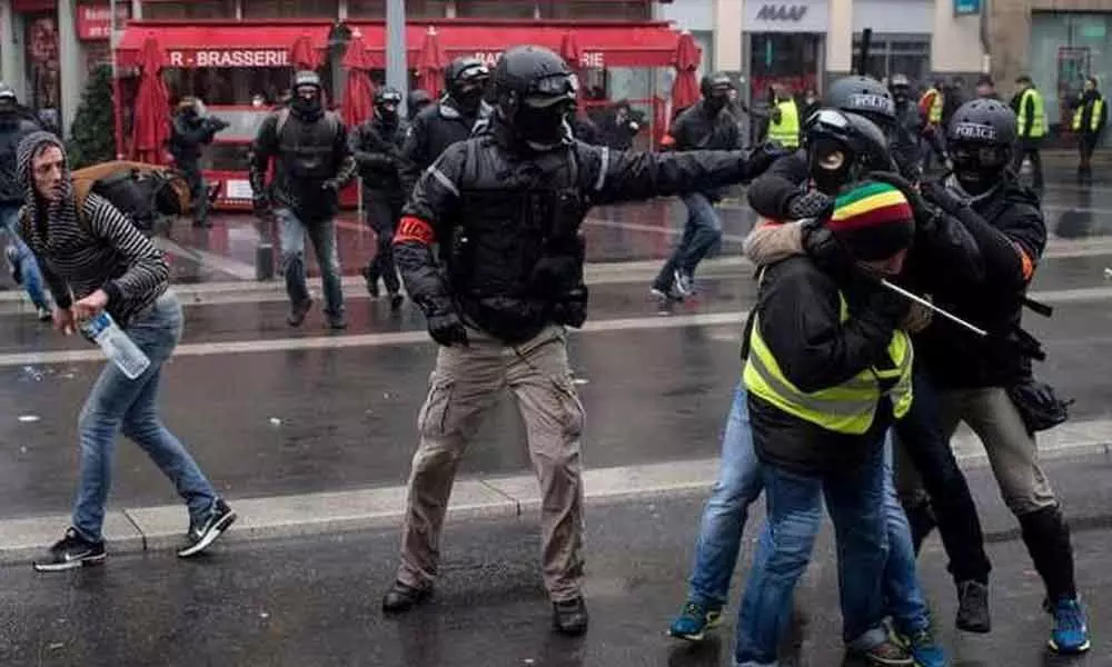 Thousands of Paris police deployed over yellow vest clash fears