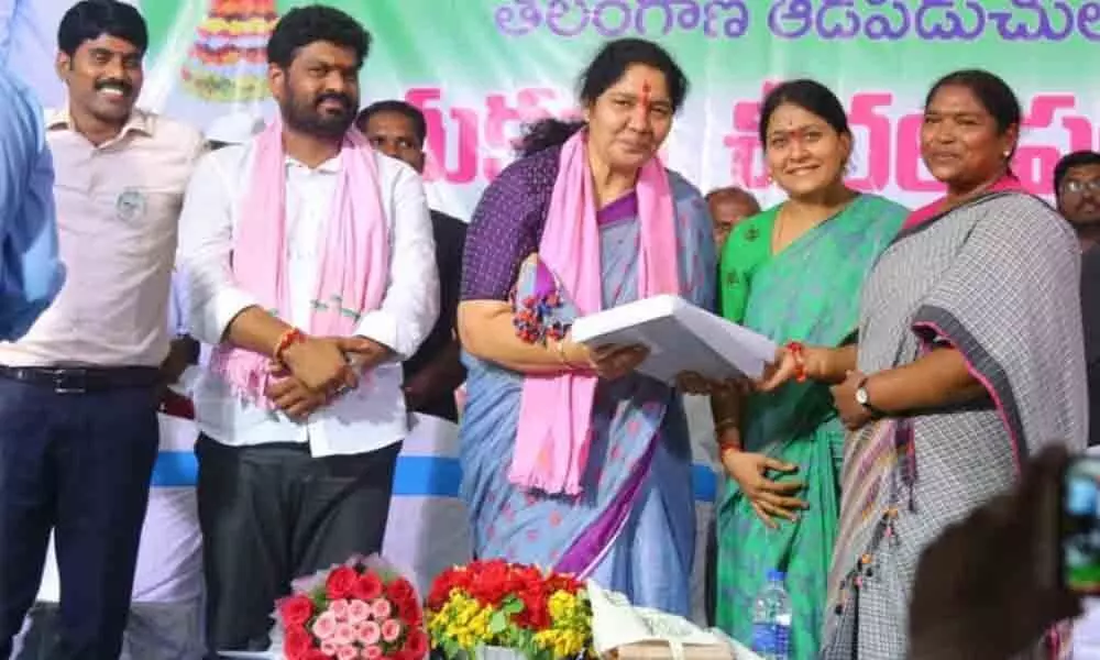 Three tribal women lawmakers distribute Bathukamma saris