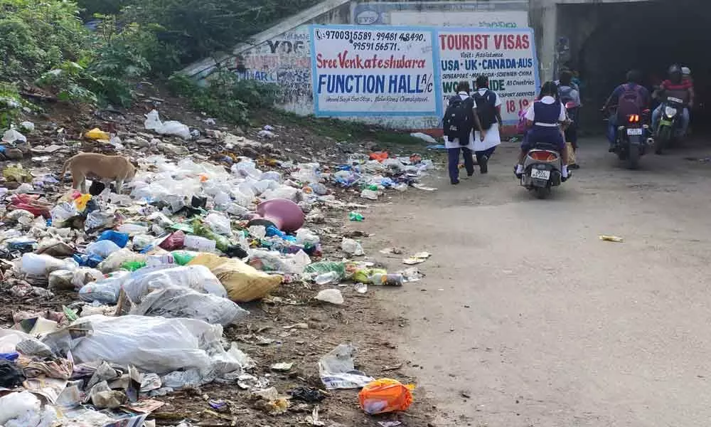 Garbage bins overflow, officials look away