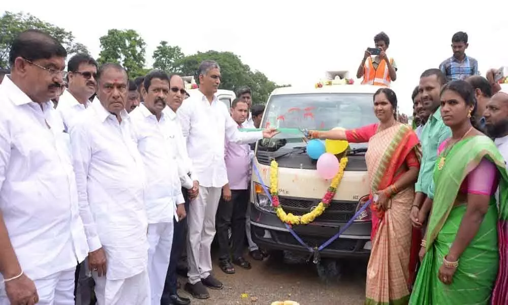 Finance Minister T Harish Rao distributes tractors, autos