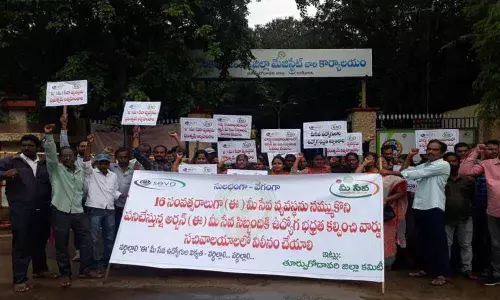 Workers stage protest seeking job security in Kakinada