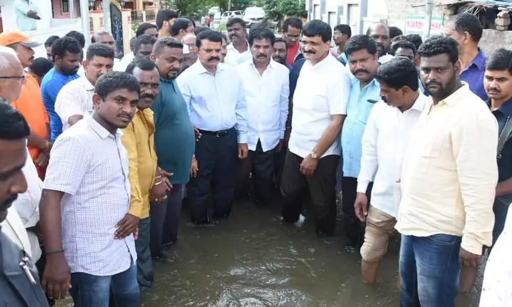 Collector Dr MV Reddy, MLA Mainampalli Hanumantha Rao visit inundated areas