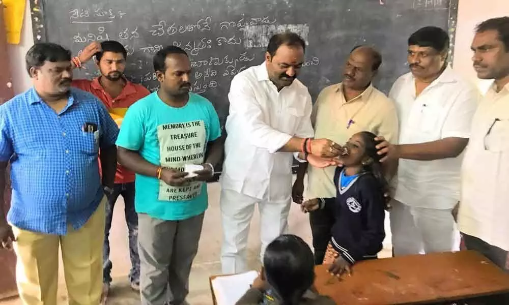 BJP distributes dengue medicine to students
