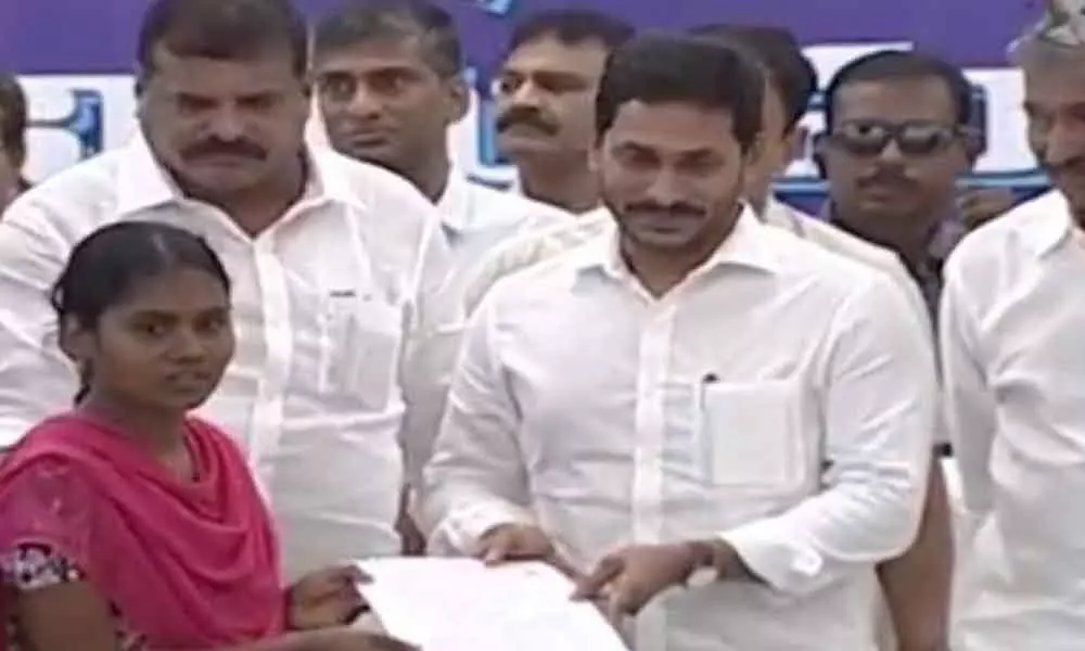 CM Jagan Mohan Reddy handover appointment order to a selected candidate in Vijayawada