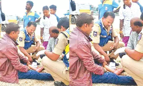 Police gesture to injured commuter