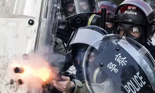 Shot HK teen charged with rioting, attacking police