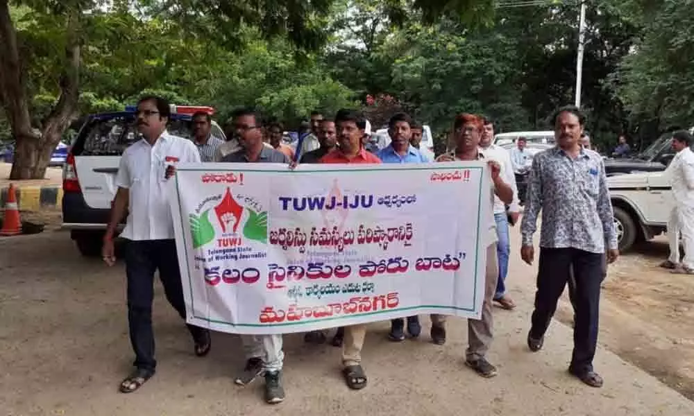 Scribes take to streets demanding the government to keep promises made to them in Mahbubnagar