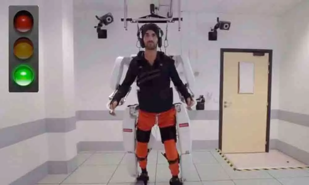 Paris: Paralysed man walks again with brain-controlled exoskeleton