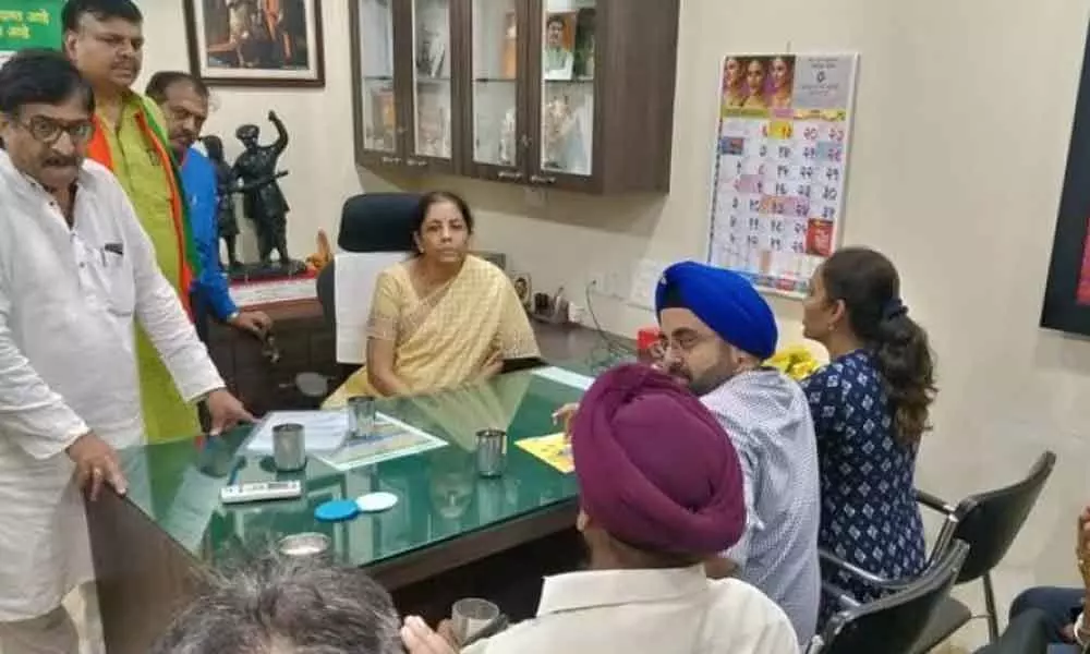 Finance Minister Nirmala Sitharaman faces protests from PMC Bank, promises legislative changes