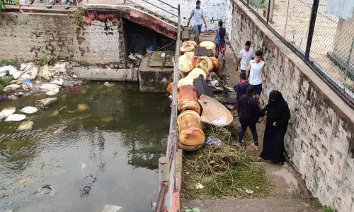 Officials dump garbage on walkway at lake