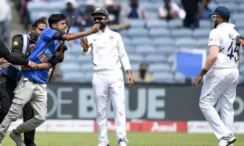 India v/s South Africa 2nd Test: Rohit Sharma fan intrudes the pitch, tries to touch his feet