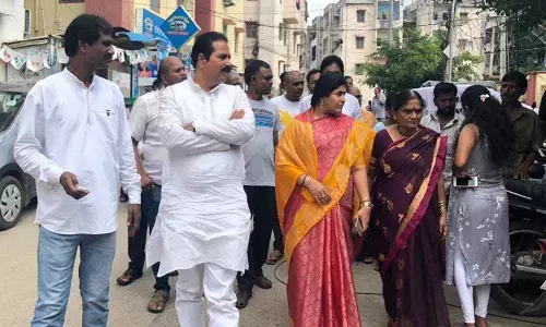 Corporator V Pujita Jagdishwar Goud interacts with residents of Janapriya