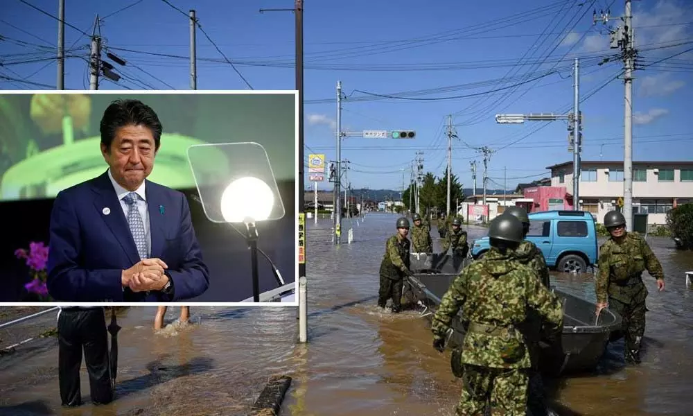 Japan PM promises action after homeless denied typhoon refuge