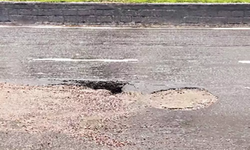 Caved-in road poses threat to motorists