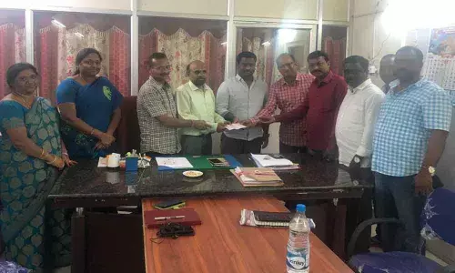 Mans gesture to spread greenery