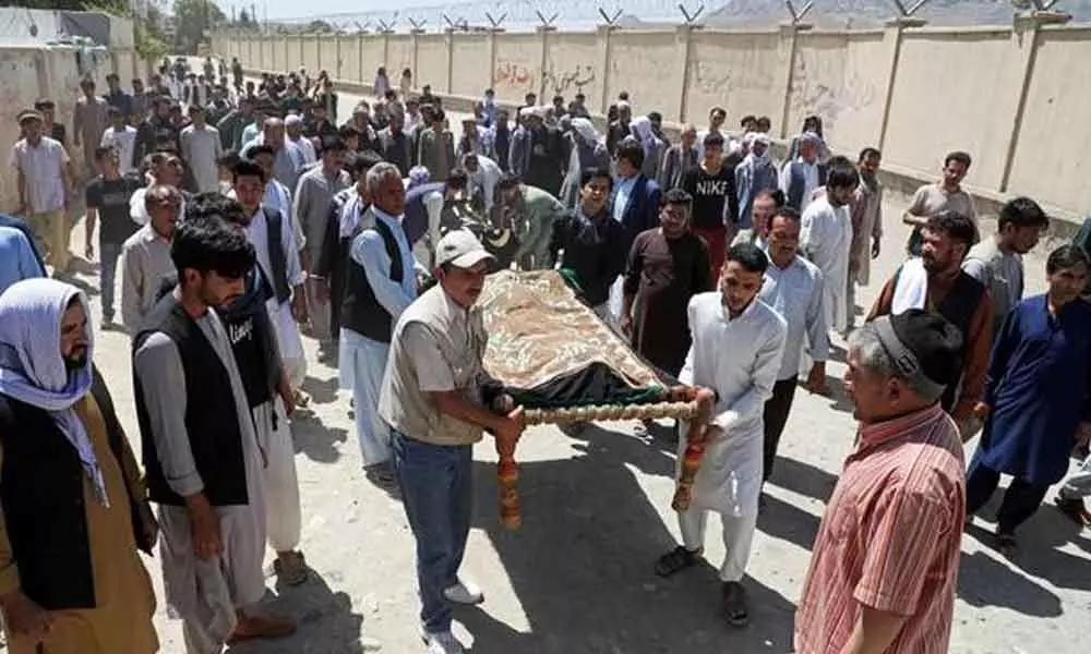 Villagers search for bodies after 70 killed in Afghan mosque blast