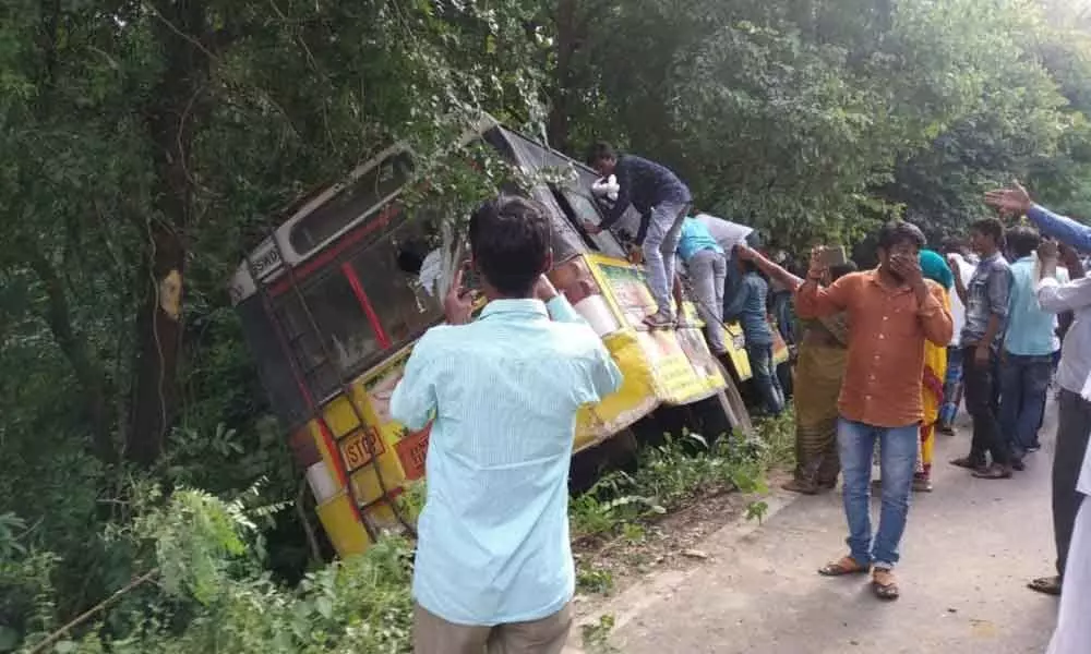 Nizamabad: Uncontrolled RTC bus hits bike, ploughs into bushes