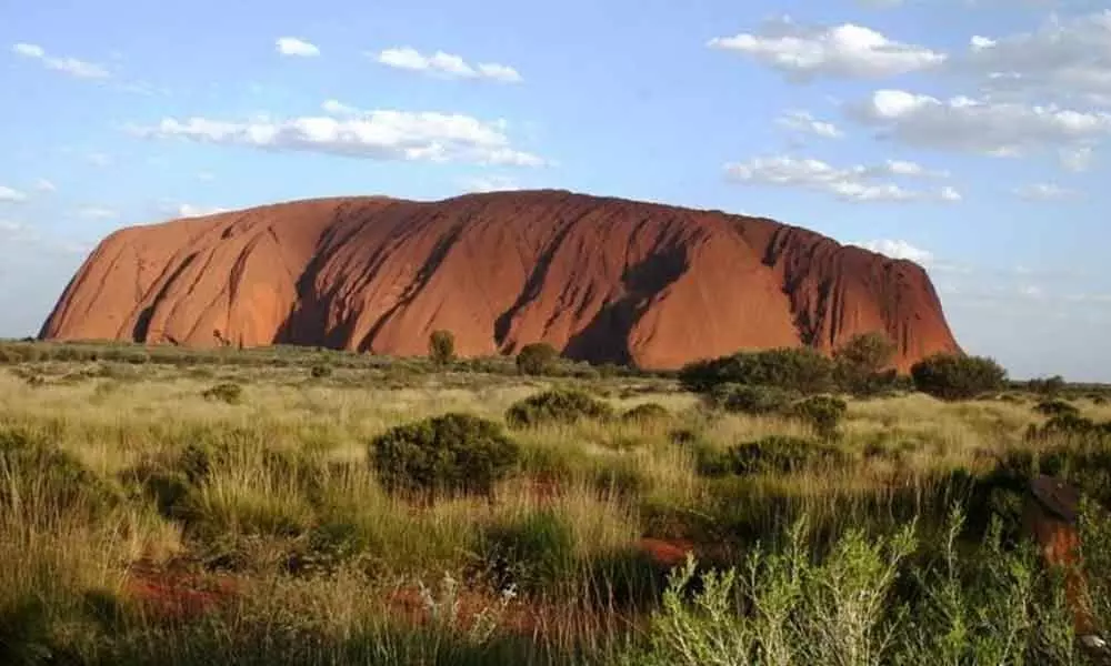 Hundreds visit to Australias Uluru for last ever climb atop the sacred monolith