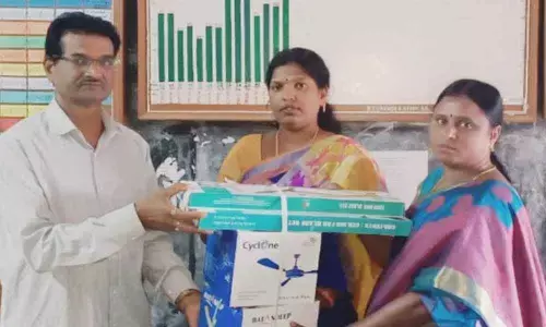 TRS leaders gesture to govt school