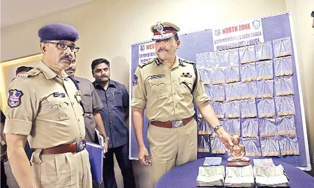 Two nabbed for deceiving people with fake gold coins, idol