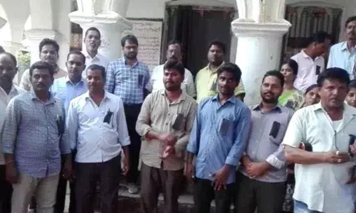 Tahsildar torched: Revenue staff protest by wearing black badges in Mahbubnagar