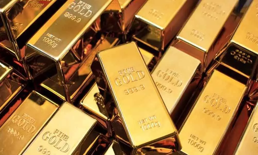 Gold demand slumps 32% as slowdown takes toll