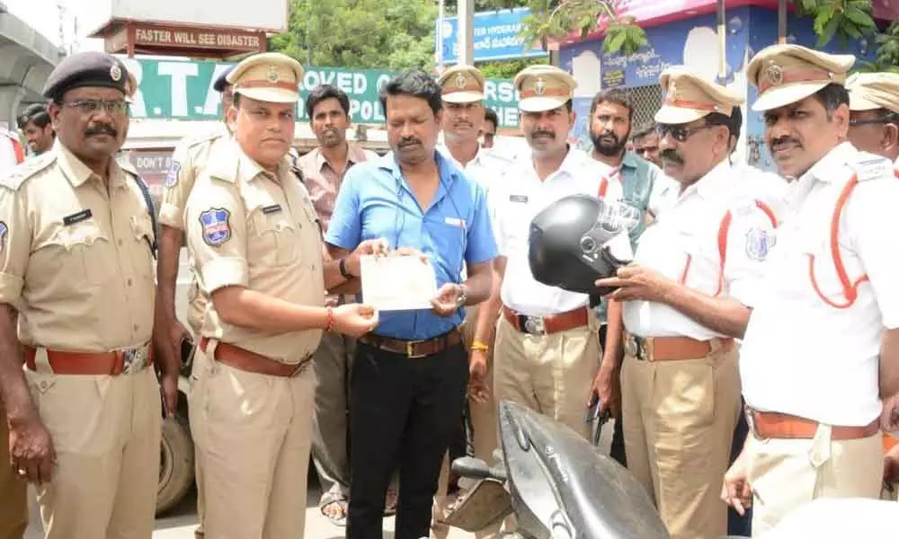 Spike in road mishaps in Rachakonda. Cops makes riders purchase helmets on the spot