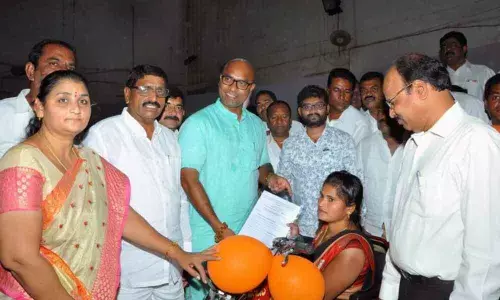 MP Arvind distributes battery-operated tricycles in Nizamabad