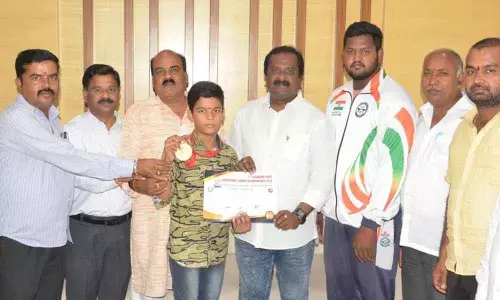 Corporator Mudraboina congratulates Karate kid
