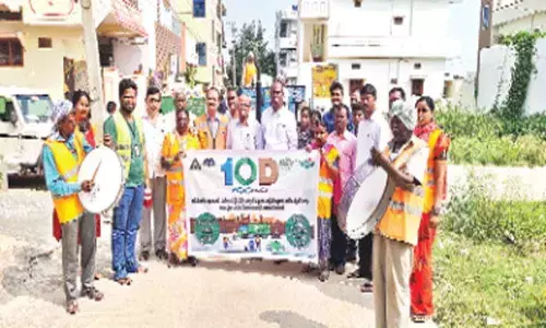Corporator Koppula Vittal Reddy, GHMC staff collect scrap at Hayatnagar