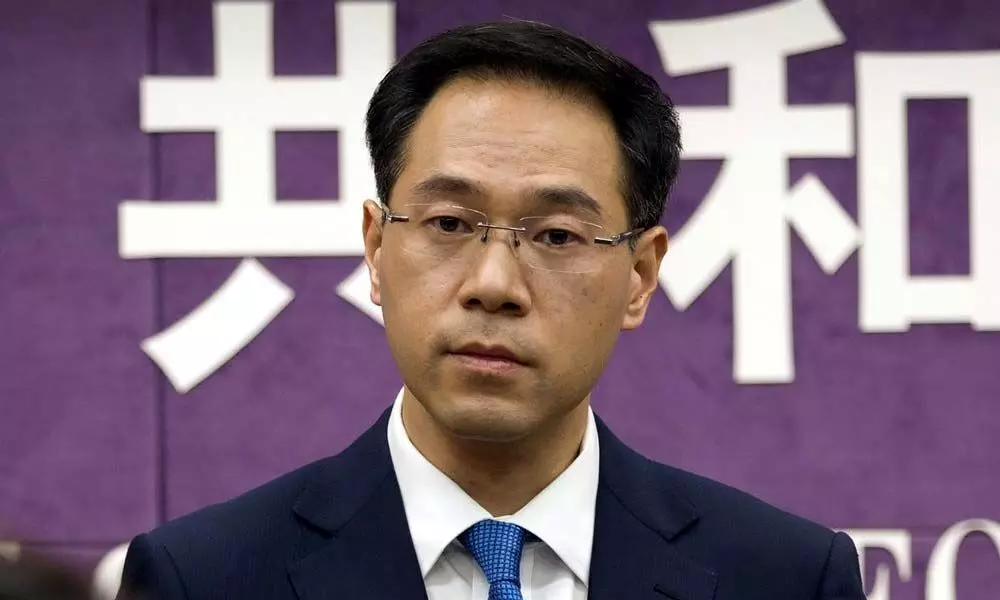 China says Beijing, US to lift tariff hikes as talks advance