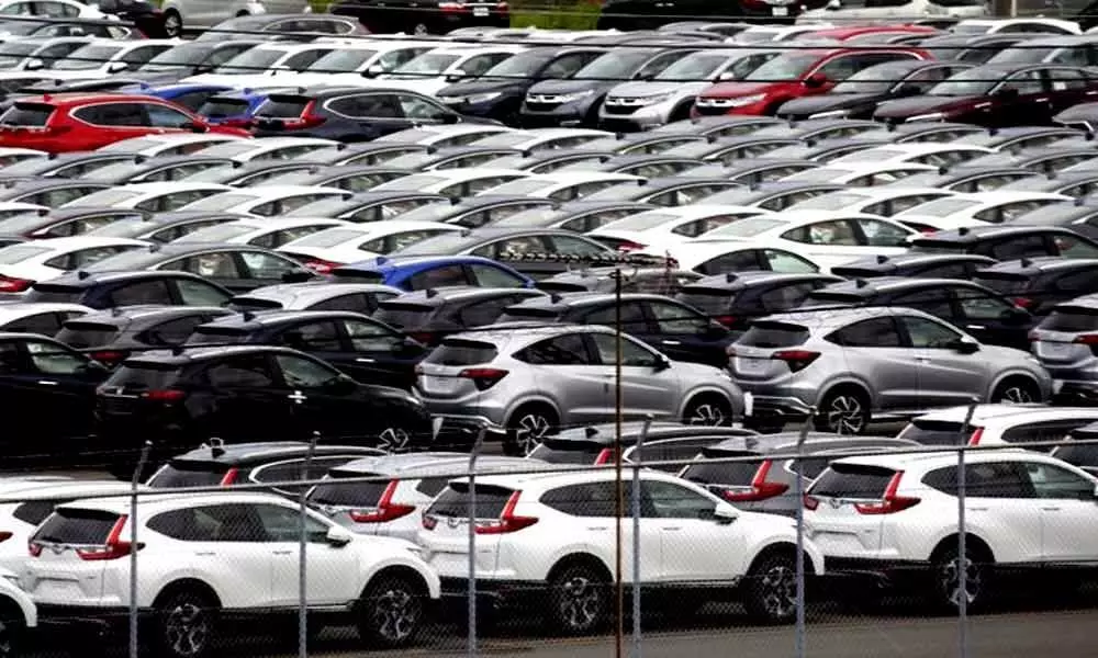 Japanese automaker Honda cuts profit outlook as sales slip