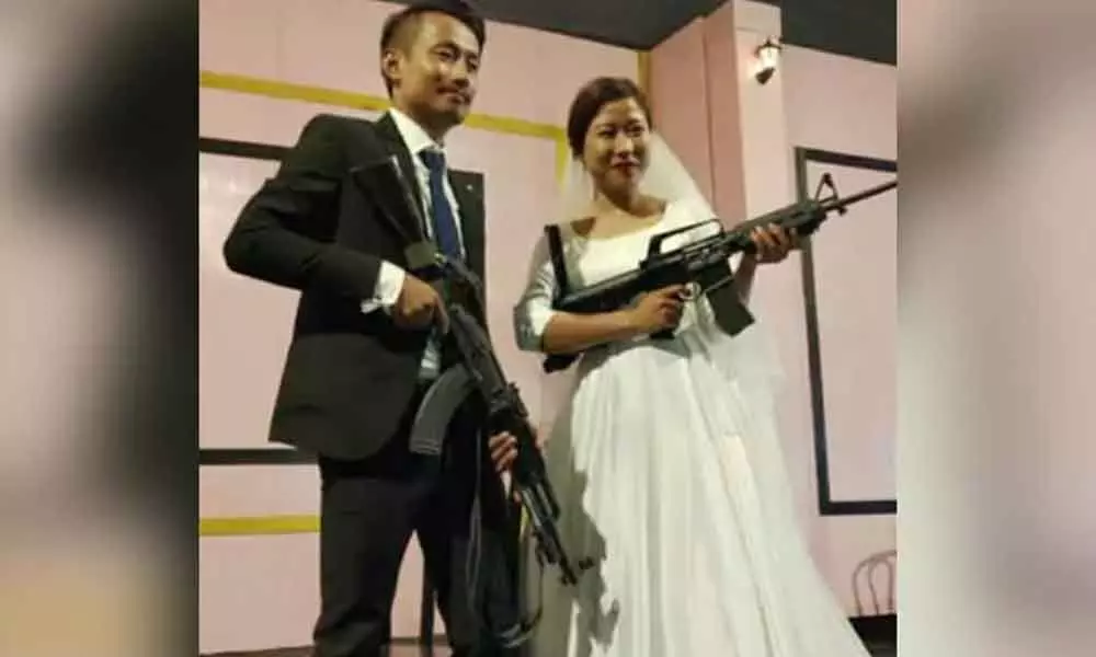 Naga rebels son, bride flaunt guns at wedding reception