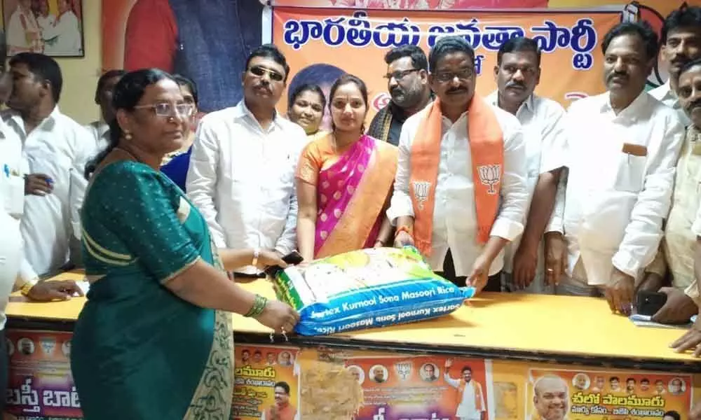 BJP neta distributes rice to RTC workers