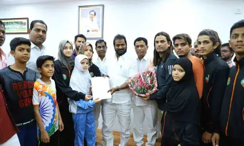 Minister V Srinivas Goud greets participants in karate championship