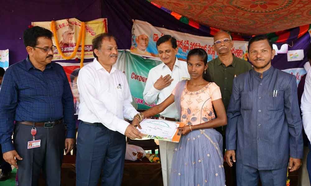 ONGC staff distributes stationery to Dr SRK School under CSR in Kakinada