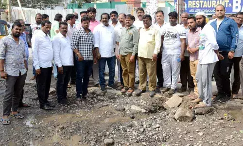 Corporator Mudraboina Srinivas Rao checks works quality