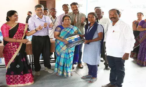 Electronics Corporation of India Limited distributes school bags to ZPHS students