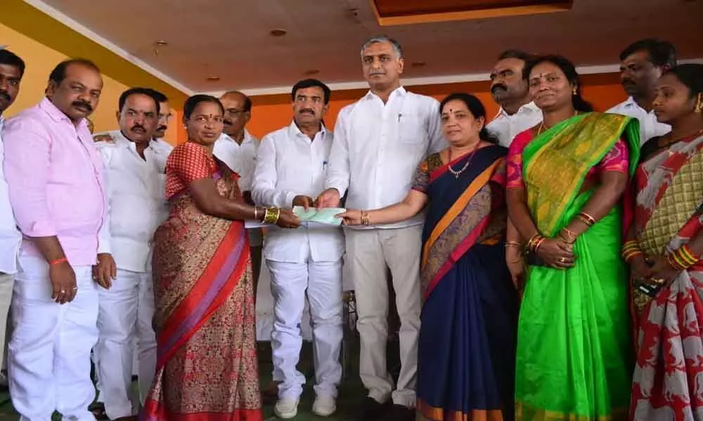 Wedding gift cheques presented at Gajwel